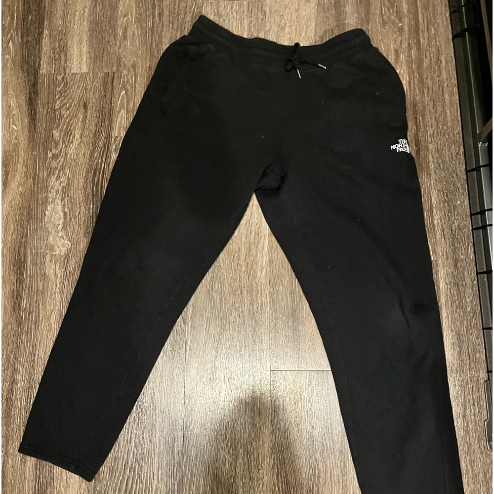 Black North Face sweats.